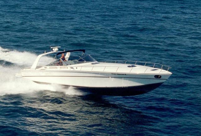 Classic Cary boat at speed on open water